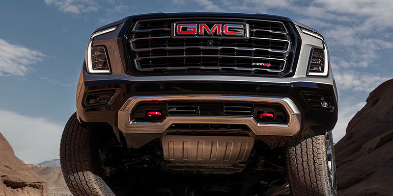 An up-angle on the front grille of the 2025 GMC Yukon XL in Carthage, MS 