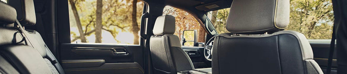 2026 Chevrolet Silverado 2500 interior in Carthage, MS showing back of driver’s seat with storage pockets and leather upholstery
