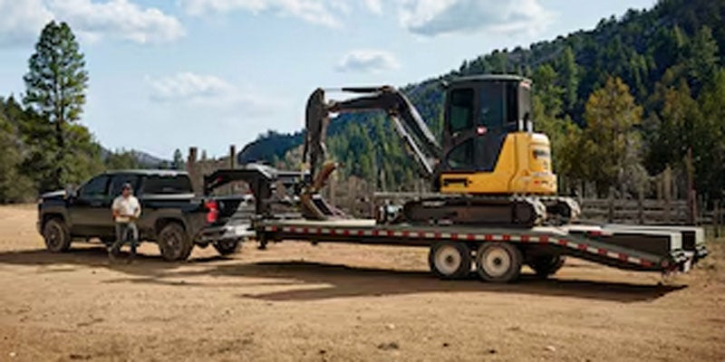 2026 Chevrolet Silverado 2500 in Carthage, MS hauling construction equipment along US-45 and MS-25