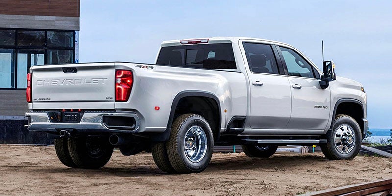 Rear view of 2026 Chevrolet Silverado 2500 in Carthage, MS showing bed, tailgate, and towing setup