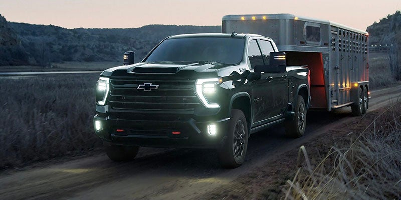 2026 Chevrolet Silverado 2500 in Carthage, MS driving on MS-16 with 6.6L V8 engine and 10-speed automatic transmission