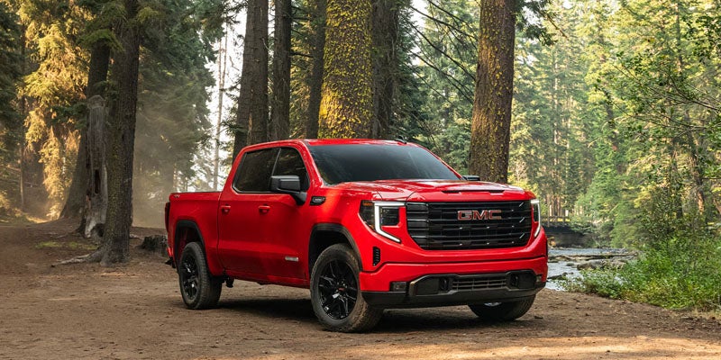 2026 GMC Sierra 1500 trim levels in Carthage MS including Pro, SLE, Elevation, SLT, AT4, AT4X, Denali and Denali Ultimate showing capability and luxury features