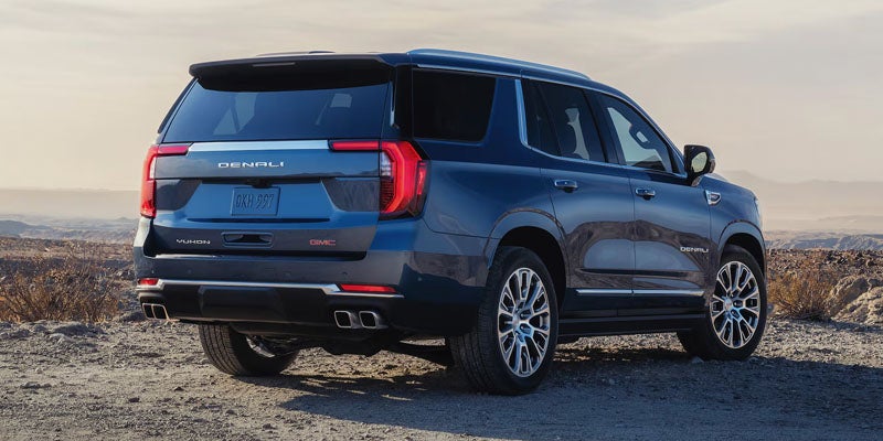 2026 GMC Yukon rear view in Carthage, MS highlighting sleek tailgate design, integrated lighting, and premium detailing for a refined, modern look.