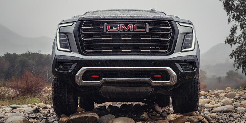 2026 GMC Yukon front grille in Carthage, MS showcasing the signature chrome accents and aggressive grille design for a distinctive and stylish appearance.